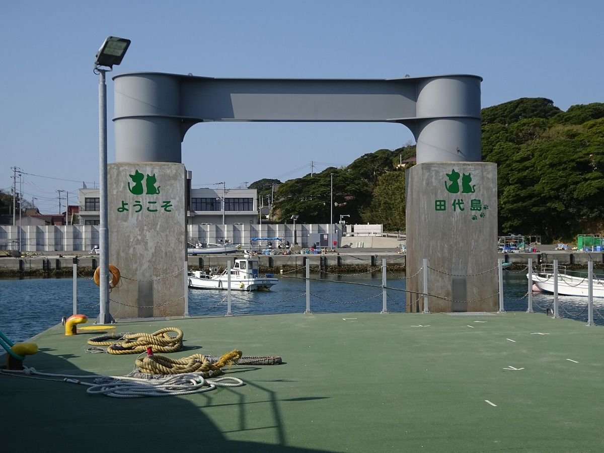 The concrete pier and gateway at Nitoda port on Tashirojima under a blue sky