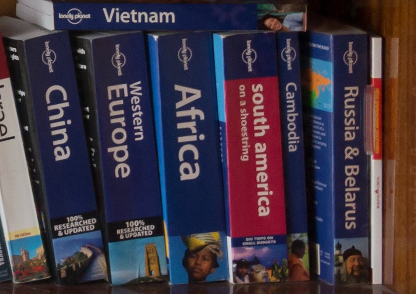 A shelf of Lonely Planet guidebooks with blue spines (item type photo, not the exact edition)