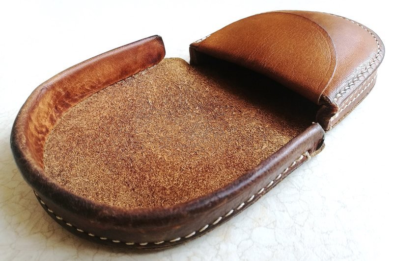 An open brown leather coin purse on a white background (item type photo, not the exact product)